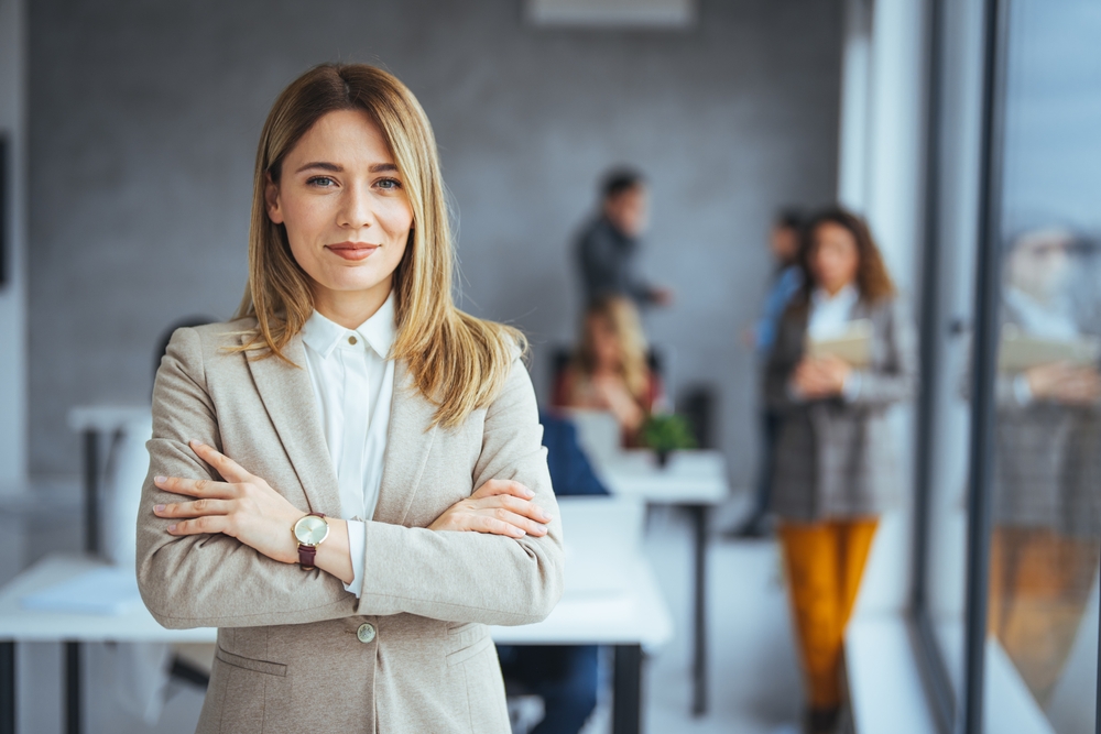 Successful,Businesswoman,Standing,In,Creative,Office,And,Looking,At,Camera.